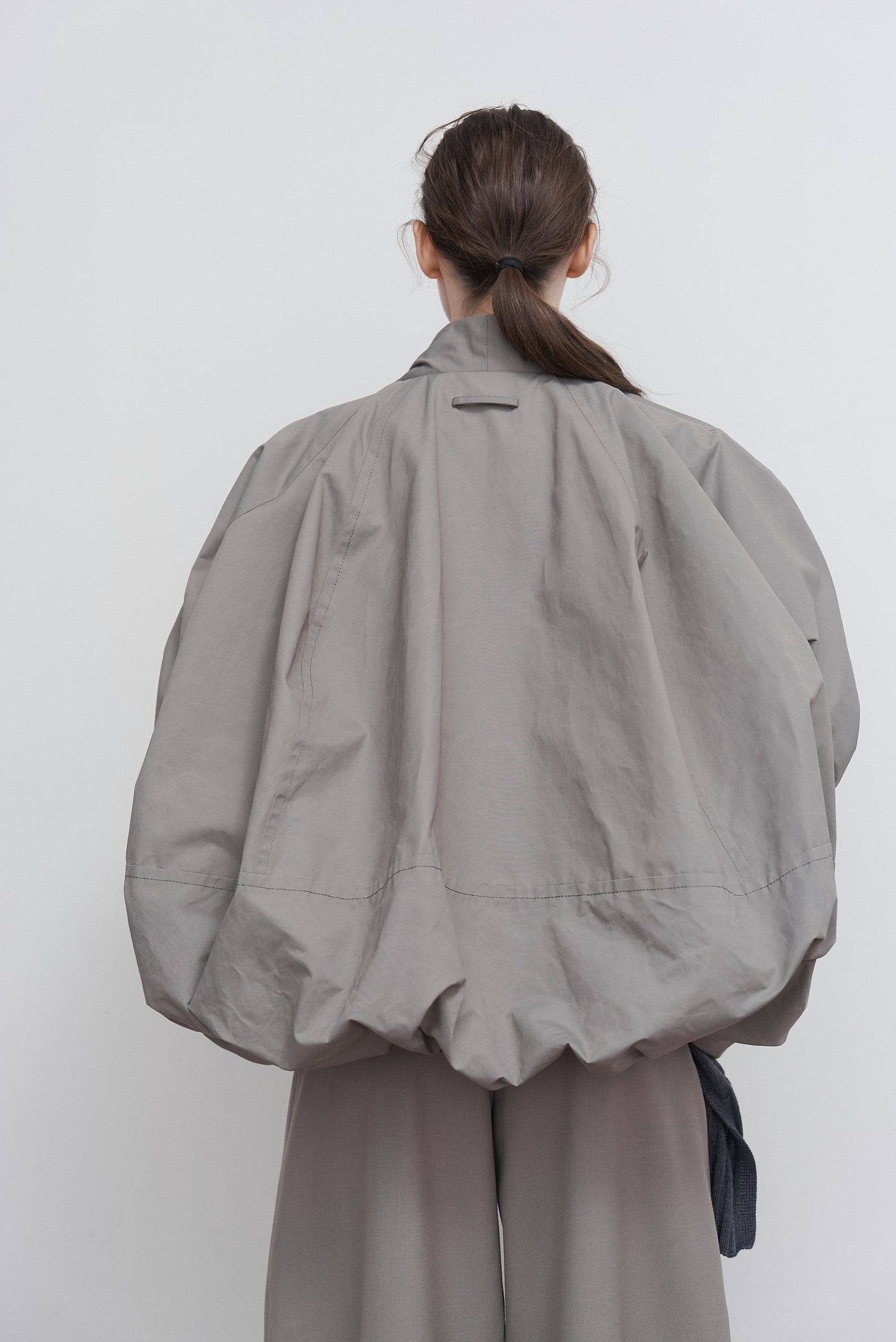 VOLUMINOUS BOMBER WITH DRAWSTRING