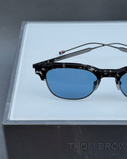 OVAL SUNGLASSES IN ACETATE AND TITANIUM WITH BLUE LENSES