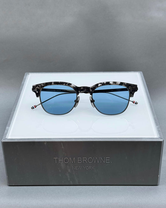 OVAL SUNGLASSES IN ACETATE AND TITANIUM WITH BLUE LENSES