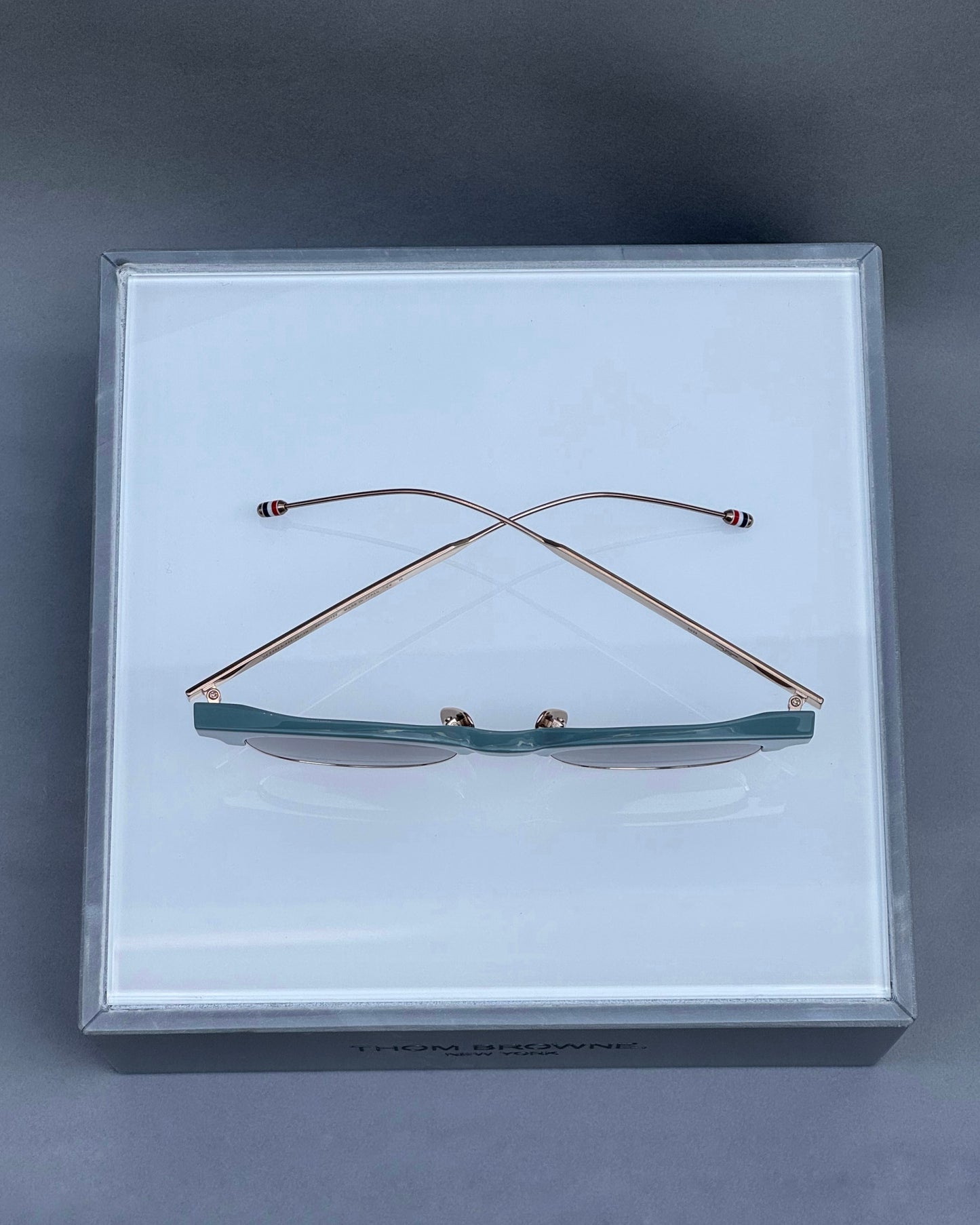OVAL SUNGLASSES IN ACETATE AND TITANIUM WITH BROWN LENSES
