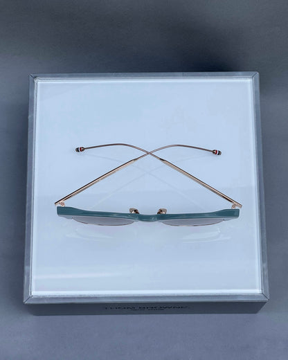 OVAL SUNGLASSES IN ACETATE AND TITANIUM WITH BROWN LENSES