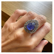 PEAR-SHAPED TANZANITE CABOCHOT ING WITH A DIAMAND HALO