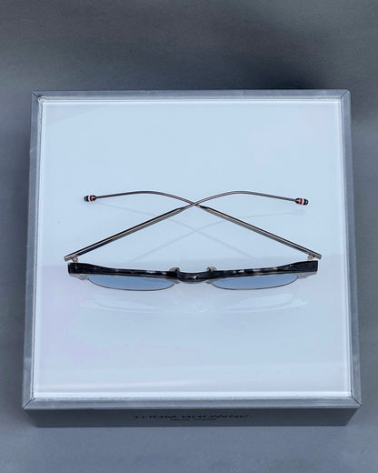 OVAL SUNGLASSES IN ACETATE AND TITANIUM WITH BLUE LENSES