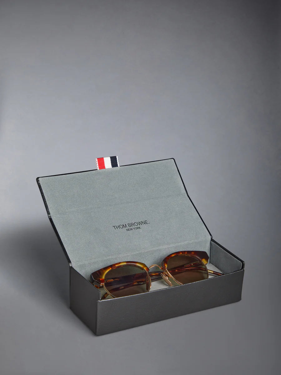 OVAL SUNGLASSES IN ACETATE AND TITANIUM GOLD