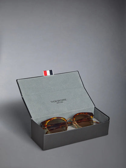 OVAL SUNGLASSES IN ACETATE AND TITANIUM GOLD