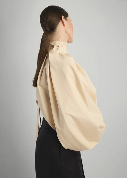 DECORATIVE ONE SHOULDER IN CREAM